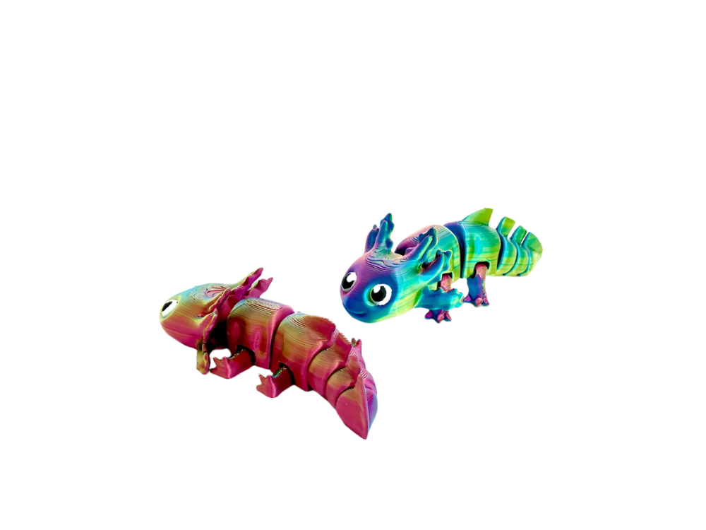 Two segmented toy axolotls, one pink, one blue-green, sit on a black surface.