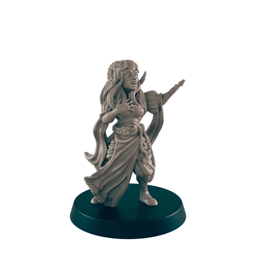 A horned, female figurine is gesturing with one arm outstretched and the other placed on her chest. She stands on a circular base against a black background.