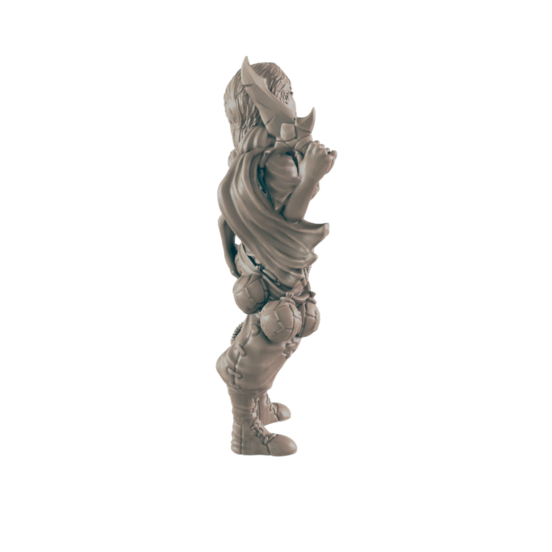 A miniature figurine stands, appearing to hold something, against a plain black background.