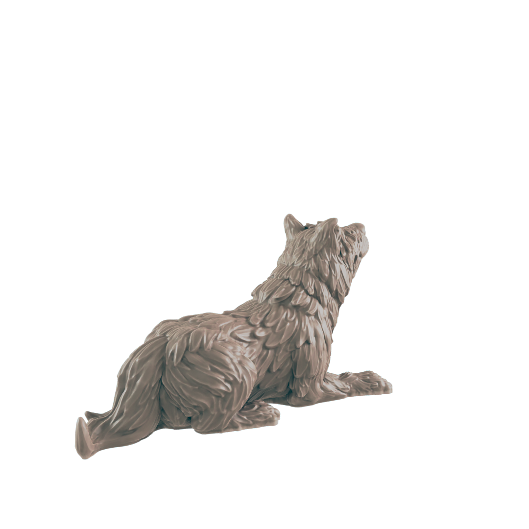 A wolf figurine lies down, looking upward, against a dark background.