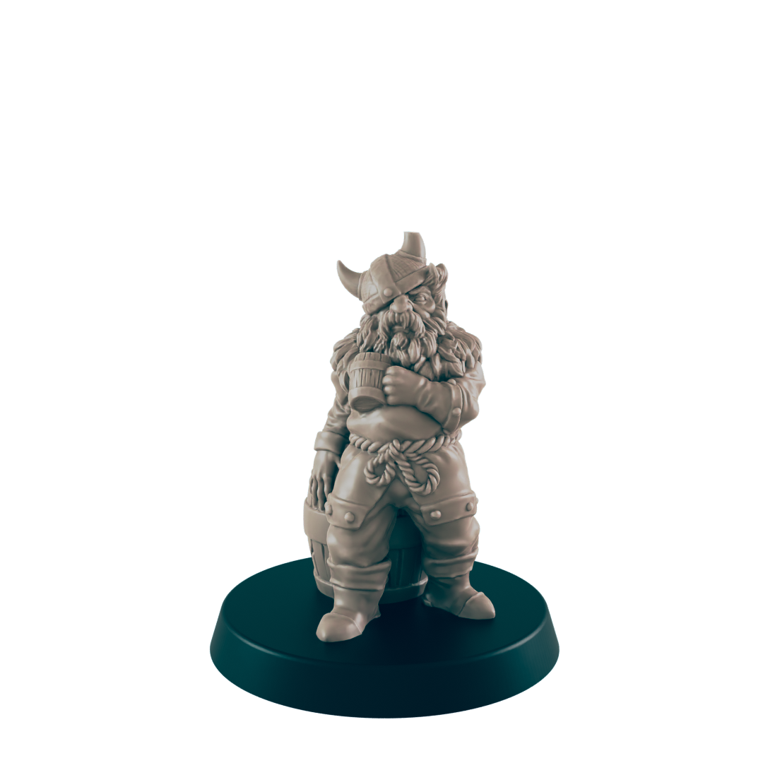 A miniature dwarf figure, standing beside a barrel, rests on a circular base. The dwarf is clad in Viking-style attire, holding a tankard.