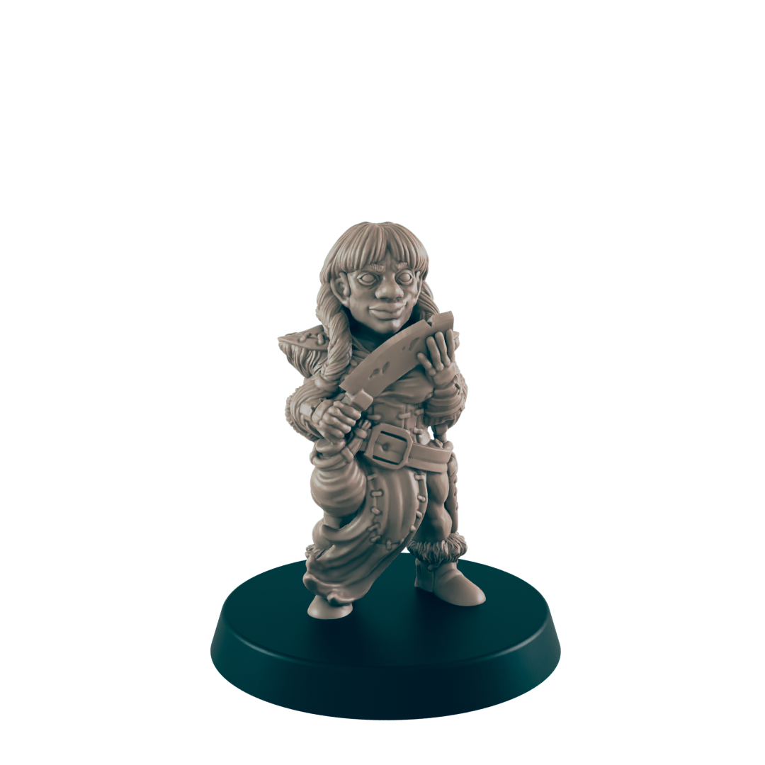 A female miniature figurine, holding a knife, stands on a dark circular base against a black background.