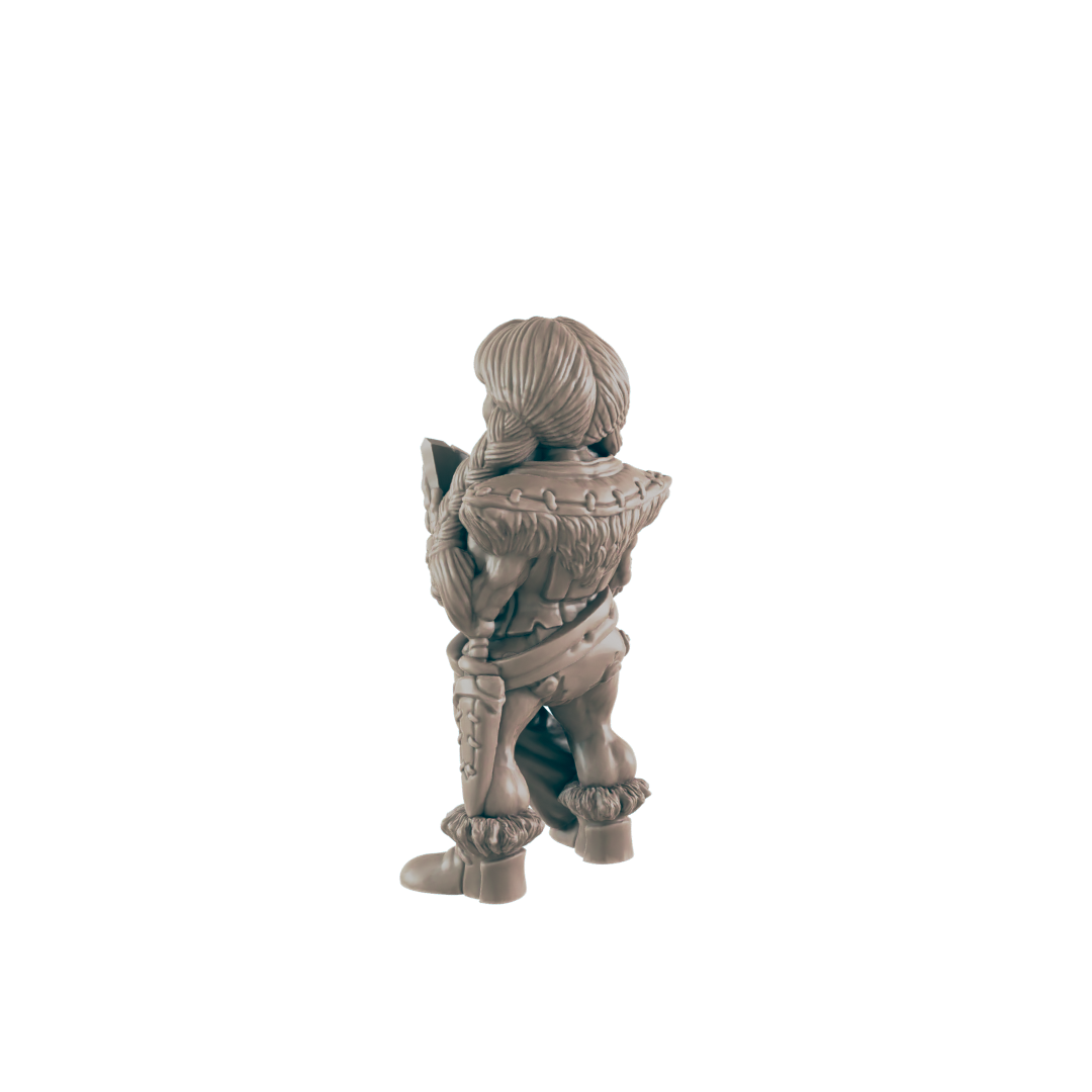 A miniature female figure, seemingly a warrior, stands facing away, holding a shield. She is clad in fur and armor, set against a plain black background.
