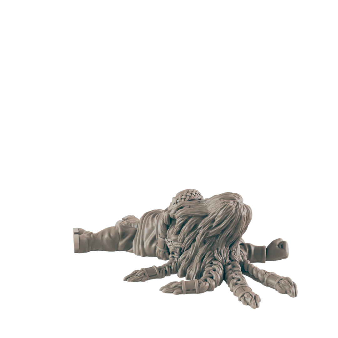 A miniature humanoid figure lies prone, its lower body transformed into a multi-legged octopus-like appendage, against a black background.