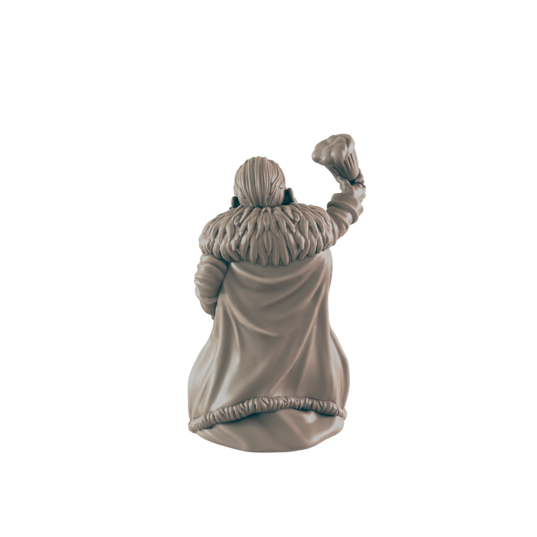 A miniature figurine, seemingly female, is raising a fist. The figure wears a fur-trimmed cloak. The setting appears to be a studio or display area.