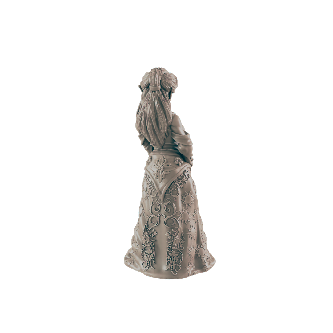 A sculpted woman stands, her back to the viewer, wearing an ornate, flowing gown. The figure is viewed from behind against a black background.