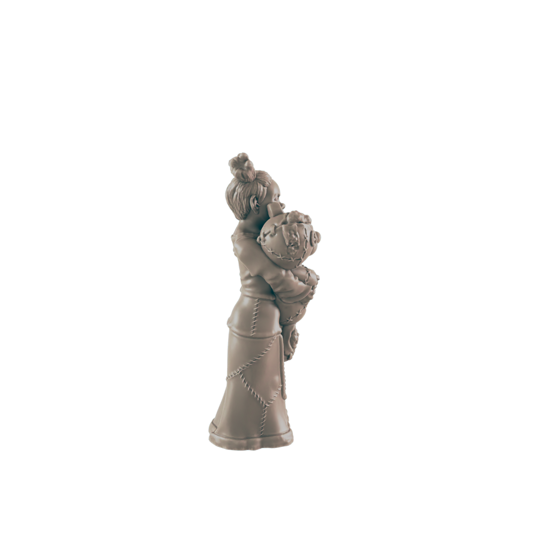 A small figurine of a girl hugs a round object; she wears a long dress. The figurine is light brown and stands alone against a black background.