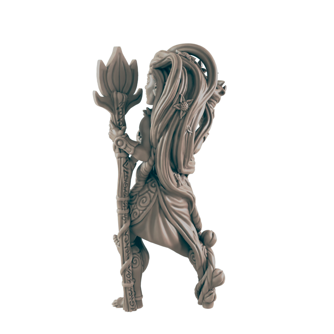 A gray, uncolored figurine of a lithe woman stands, holding a tall staff topped with a lotus-like flower. Vines and floral patterns adorn her body and the staff, on a white background.