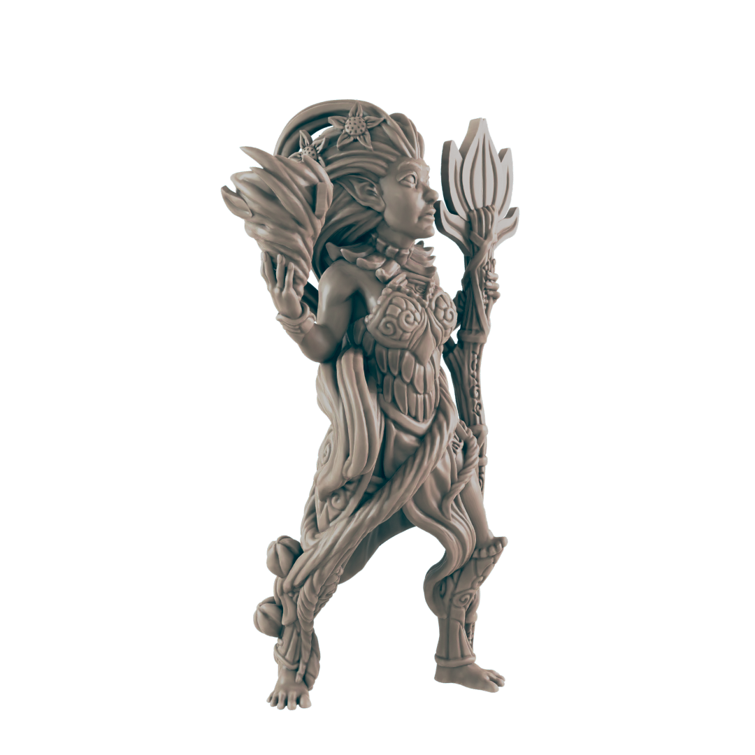 A miniature figurine of a wood elf stands, holding a staff and a leafy element; against a dark background.