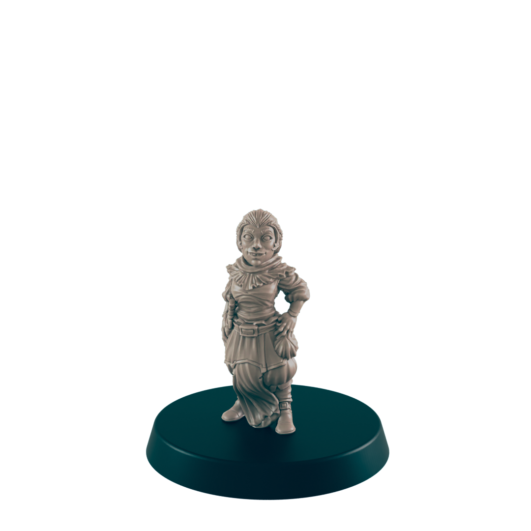 A small, female figurine stands on a dark circular base. She appears to be wearing a robe and boots. The figurine is light beige in color.