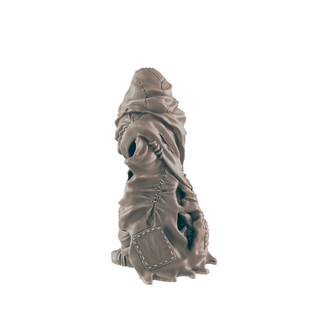 A sculpted figure, appearing humanoid and cloaked, sits against a dark background. The cloak is tattered and stitched, showing glimpses of the figure underneath.