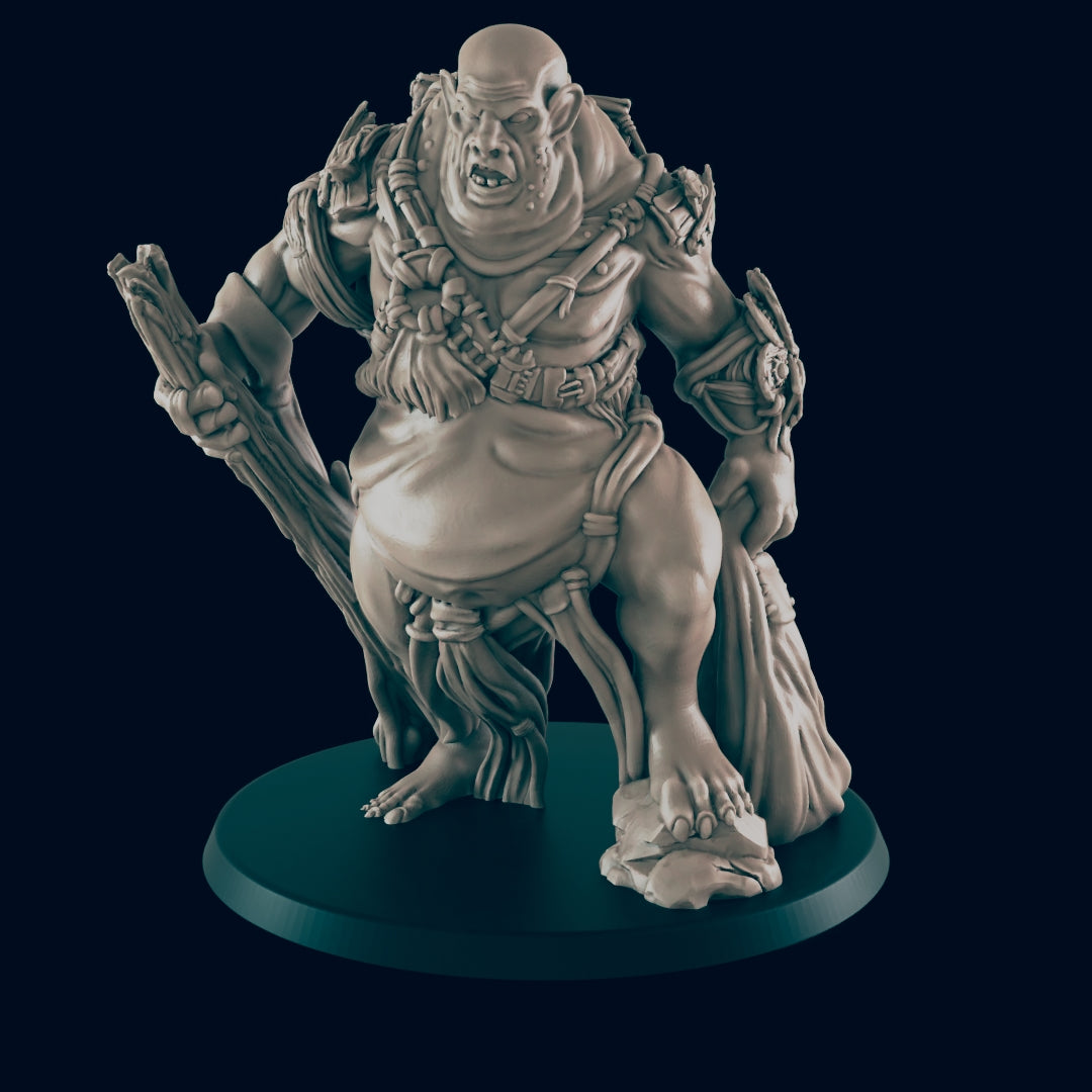 A stout, grotesque figurine stands on a dark circular base. The figure holds a large stick and a sack, appearing to be a type of ogre or troll.