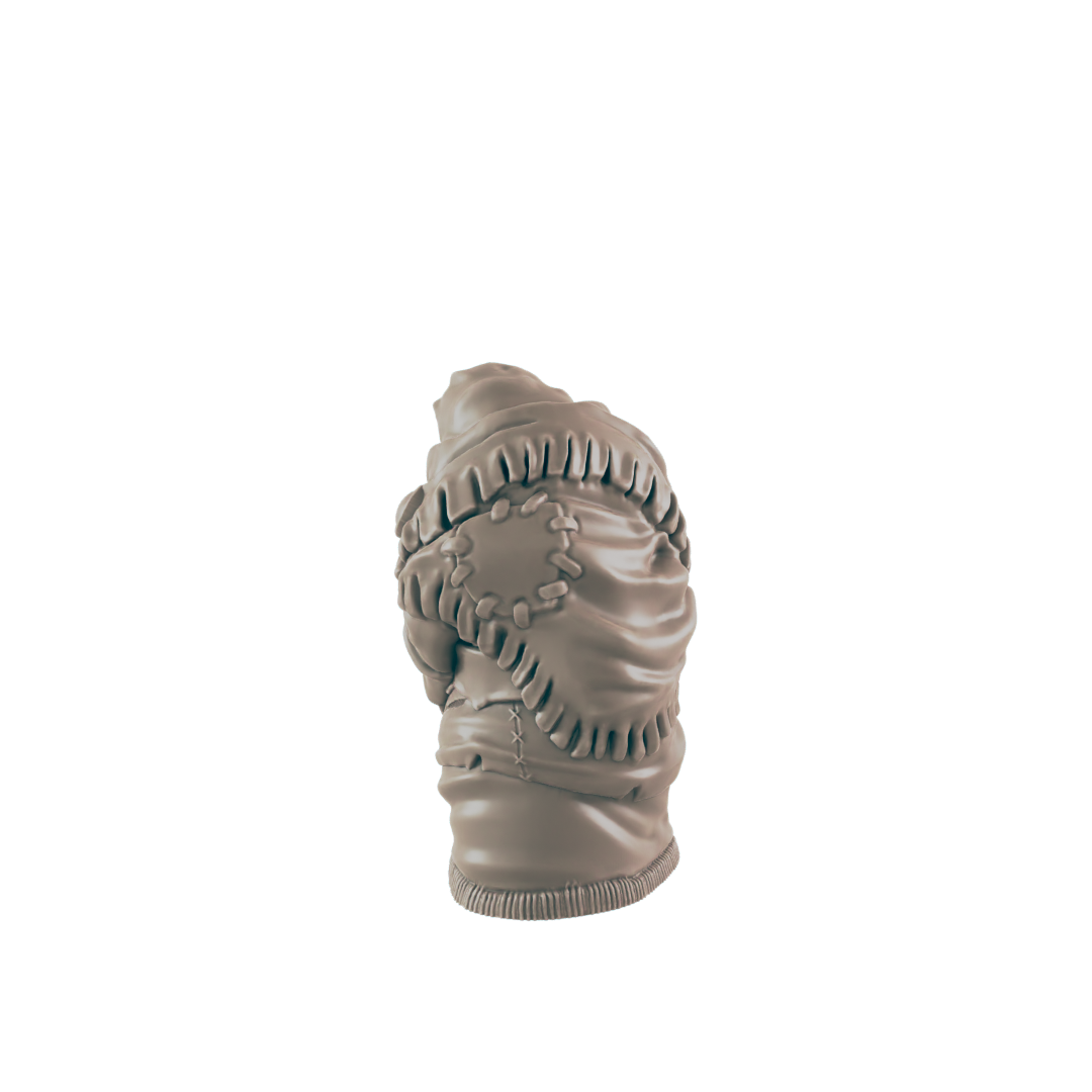 A sculpted torso, seemingly wrapped in tattered fabric, sits against a dark background.