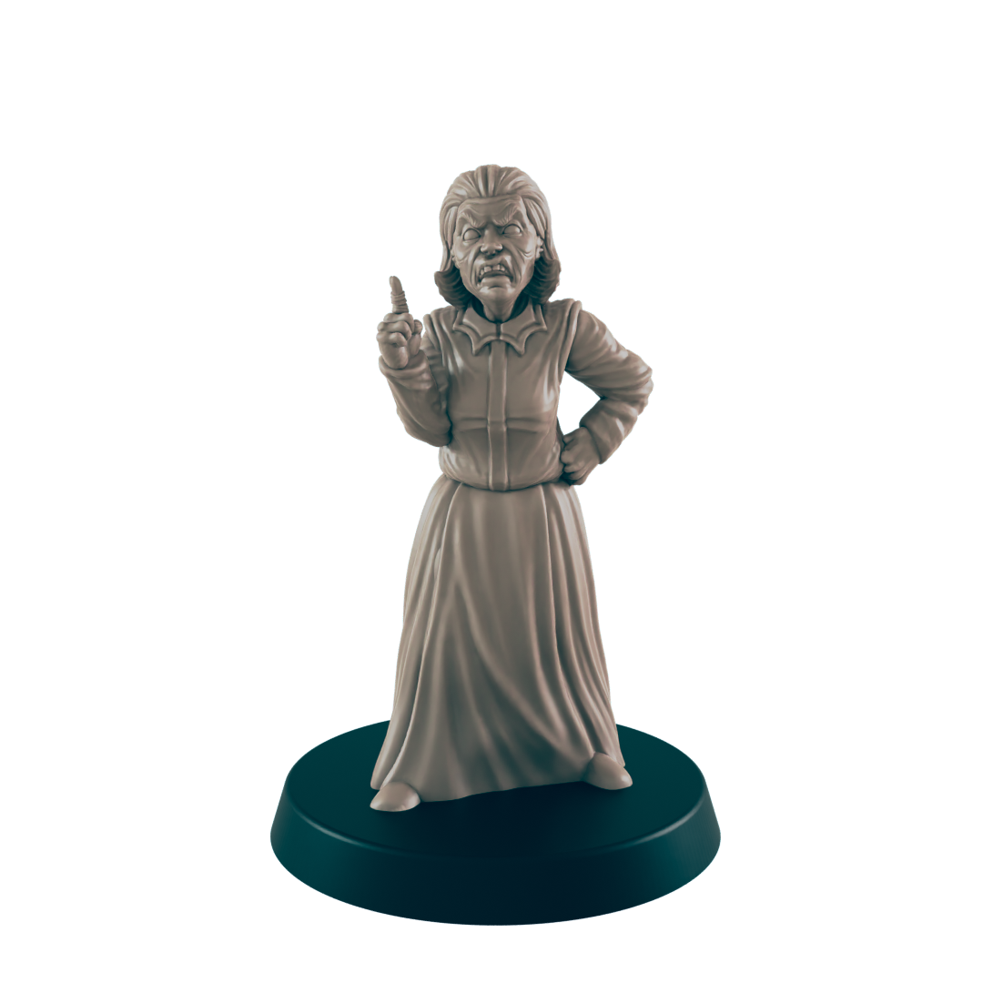 A miniature figurine of an angry woman, stands with one hand on her hip and the other raised in reprimand, on a circular base.