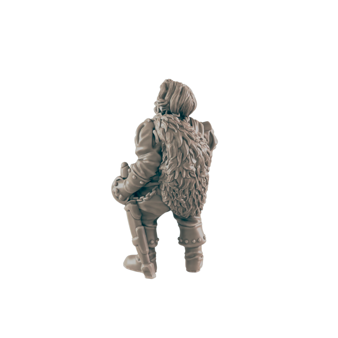 A miniature figurine of a stout, fur-clad figure sits, possibly a dwarf warrior, against a black background.