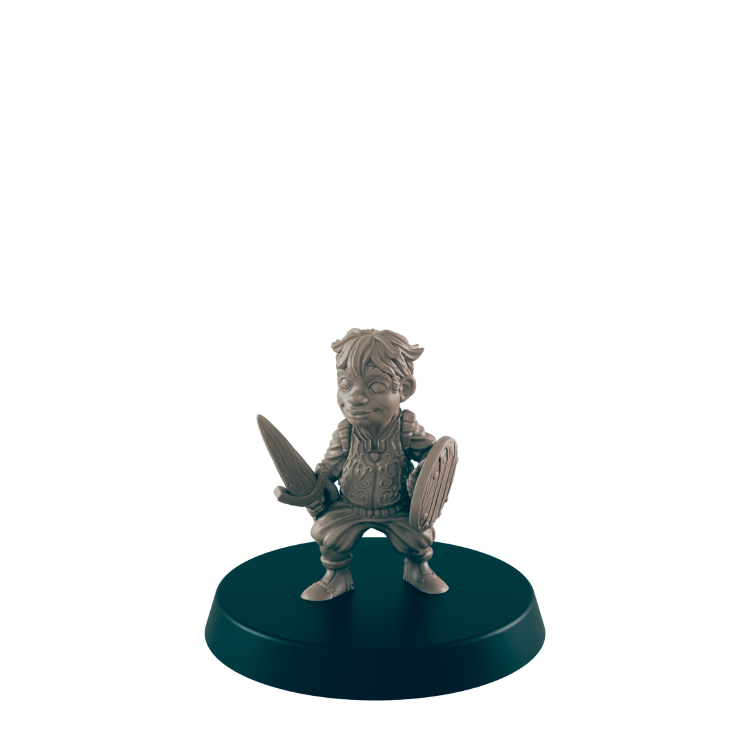 A miniature figurine of a young warrior, wielding a sword and shield, stands on a dark circular base.