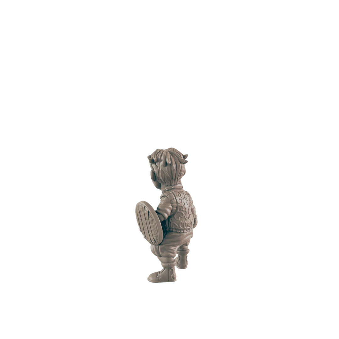 A small, sculpted figure of a child, holding a shield, stands against a black background.