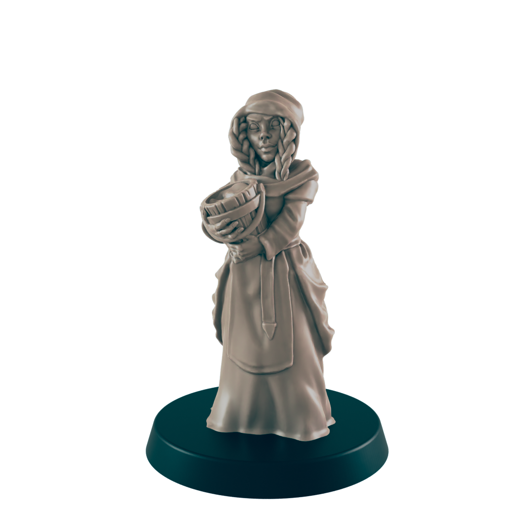 A miniature figurine of a woman, holding a pail, stands on a circular base. She wears a hooded robe and long dress.