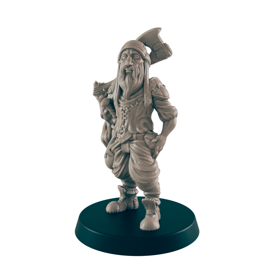A miniature figurine of a bearded dwarf stands, carrying an axe, on a dark circular base.