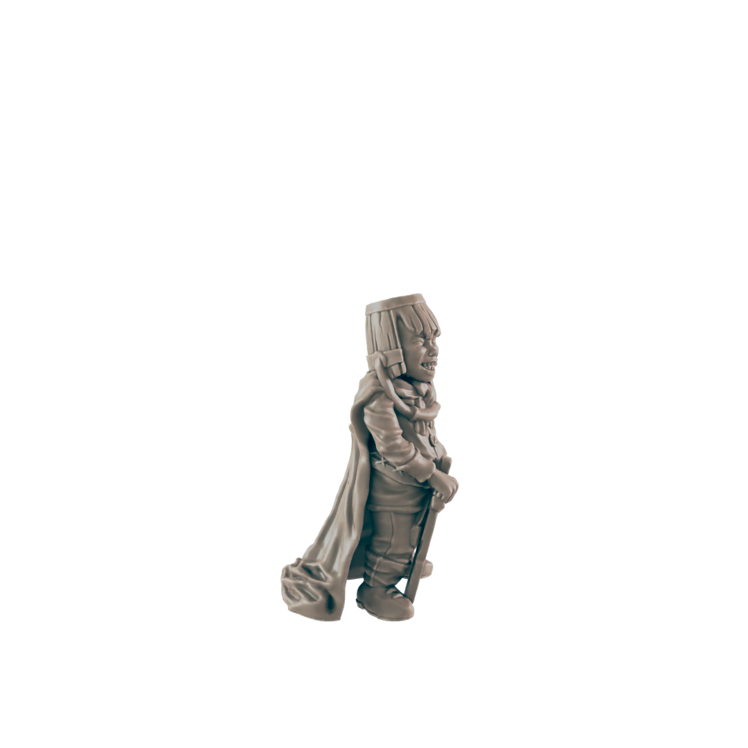 A miniature figurine of a grinning, cloaked figure stands, holding a staff; it’s positioned against a dark background.