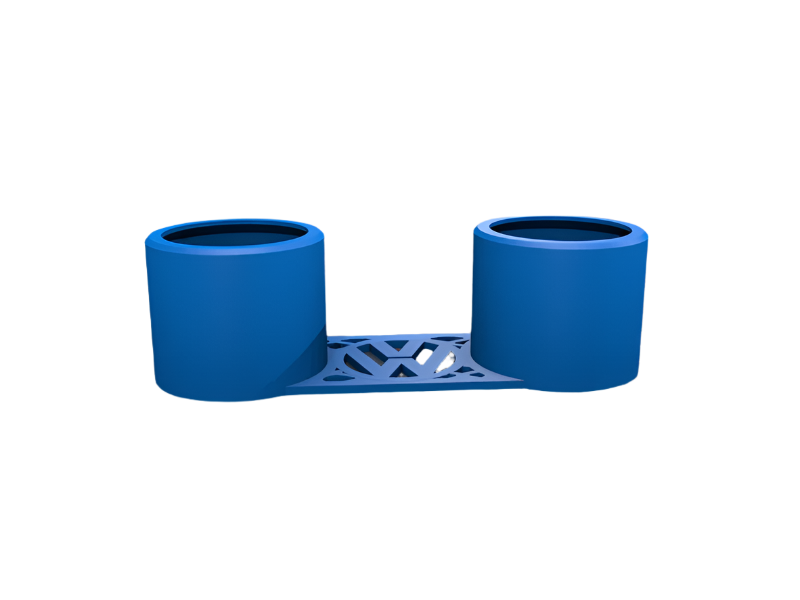 A blue dual cup holder sits on a surface. The holder is connected by a patterned bridge.