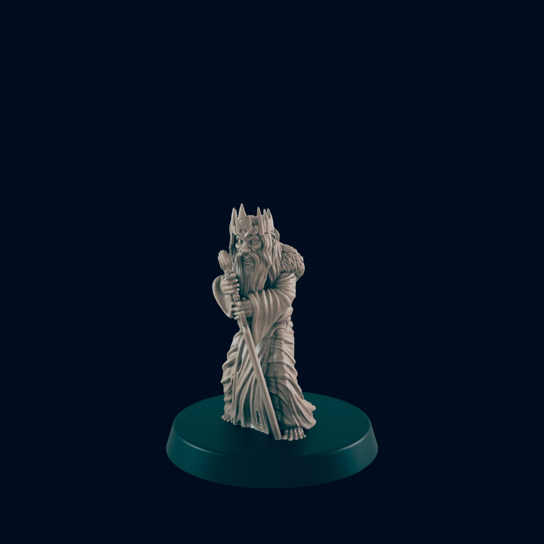 A wizard figurine stands on a round platform in a dark blue space, holding a staff. The figurine has a long beard, wears a crown and robe, and appears to be made of bone or ivory.