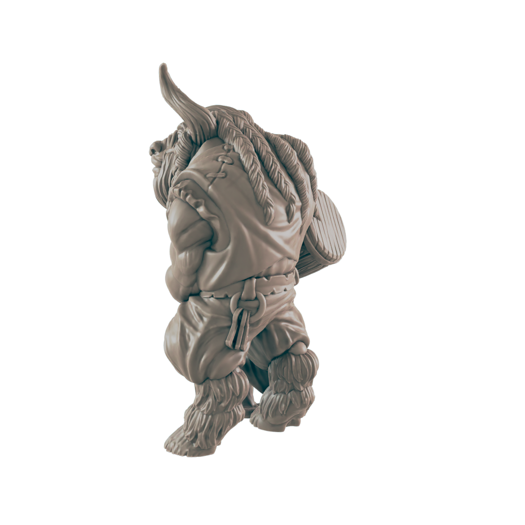 A miniature figurine of a Minotaur, carrying a shield, walks against a black background.