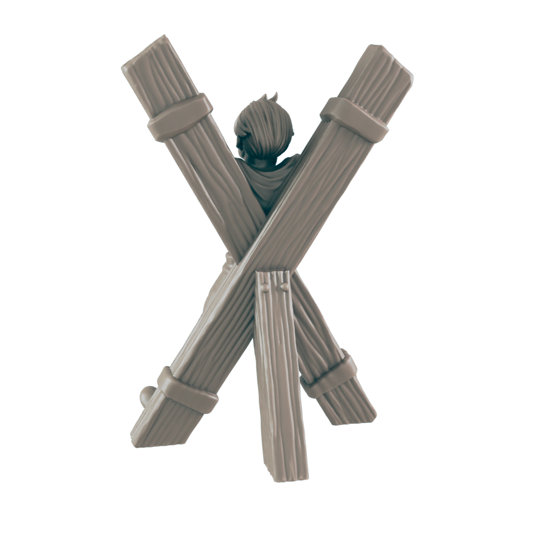 A miniature figure is bound to a wooden pillory; the figure's back is to the viewer. The setting appears to be a dark, isolated space.