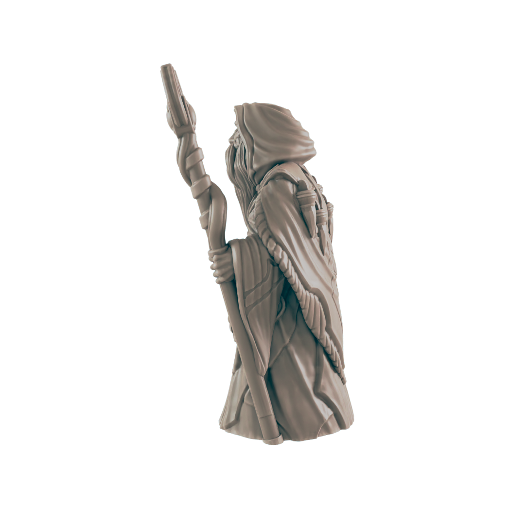 A miniature wizard figurine stands, holding a staff; against a dark background.
