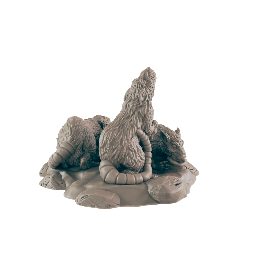 Three rats are sculpted, interacting on a small, textured base. They appear to be huddling or fighting. The setting is implied to be a dark, rocky environment.