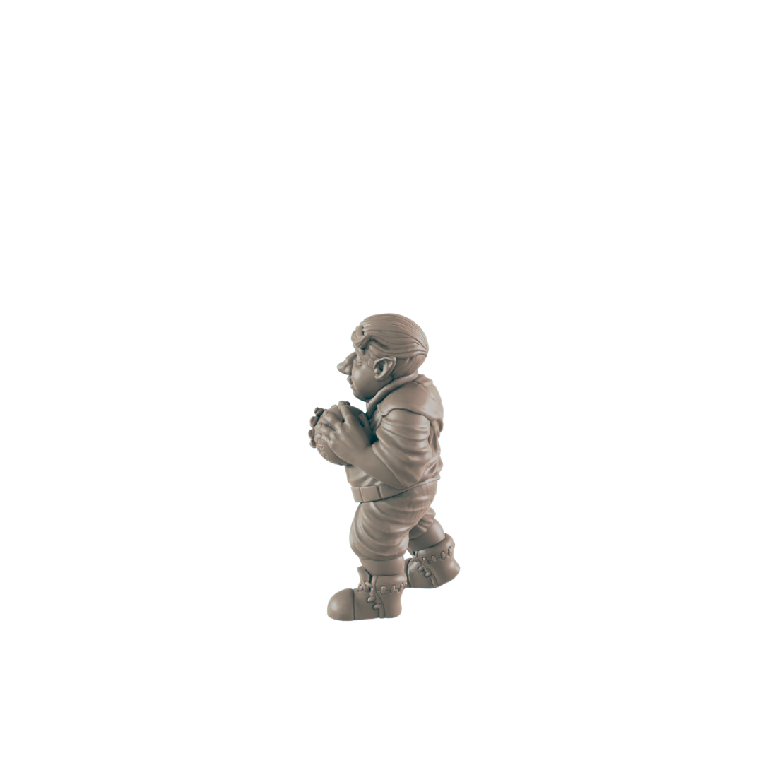 A small, stout figurine holds a sphere, standing against a dark background.