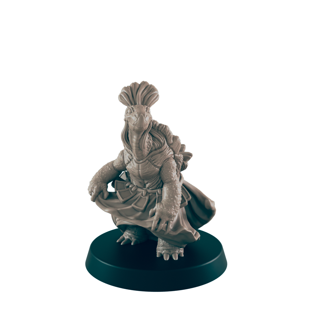 A turtle figurine, wearing a skirt, adjusts its garment. It stands on a circular base against a dark background.