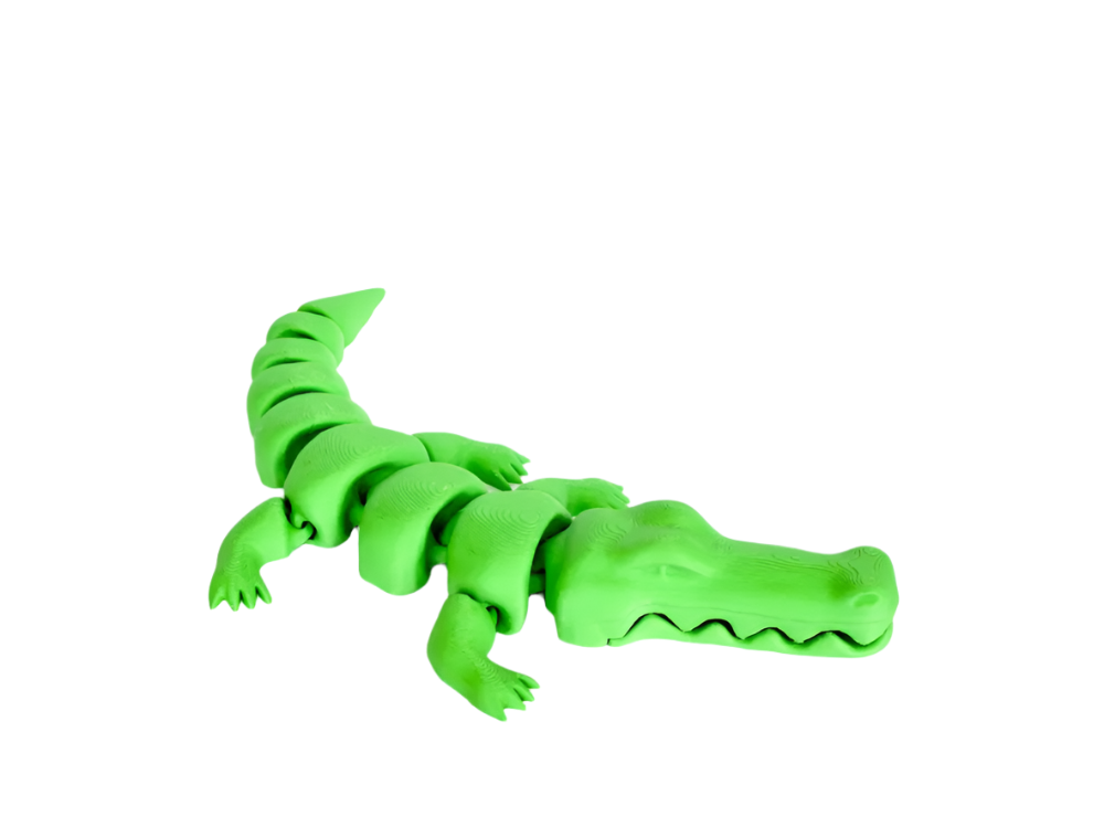 A segmented, neon-green plastic alligator crawls in a black void.