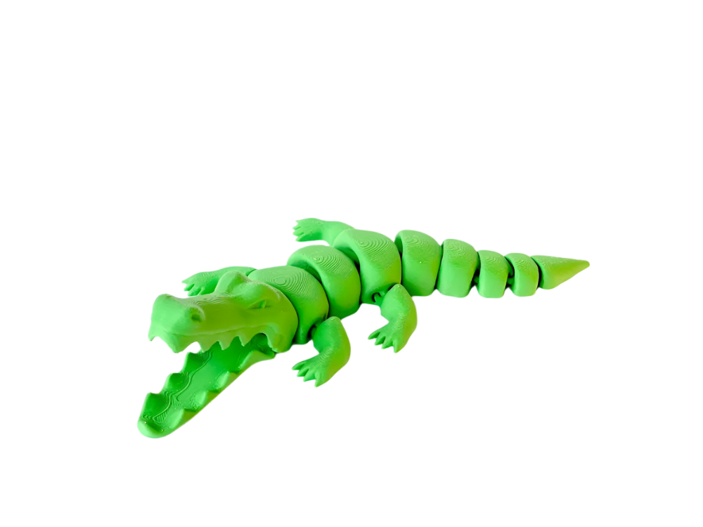 A neon green toy alligator with an open mouth sits on a black background. Its body is made of segmented pieces.