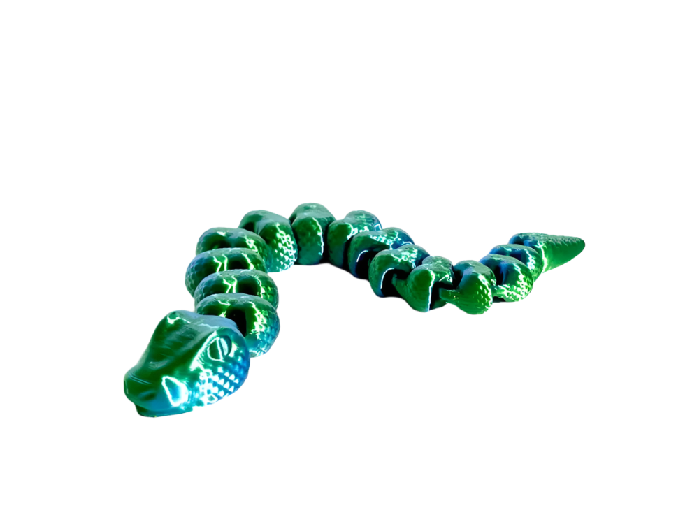 A shiny green alligator toy curves from left to right, its segmented body displayed against a solid black background.