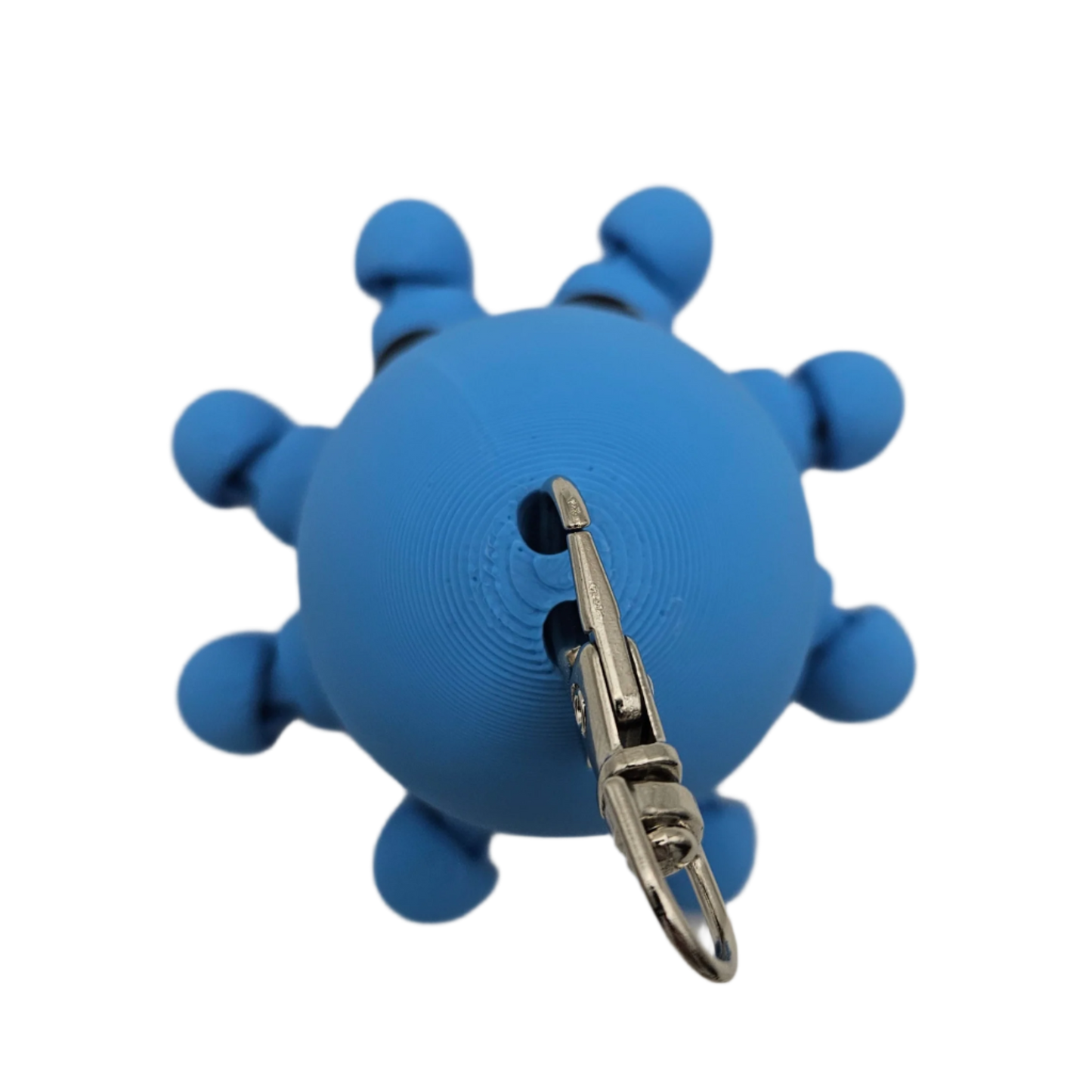 A blue, spherical toy with nub-like appendages and a key-chain clasp hangs against a black background.