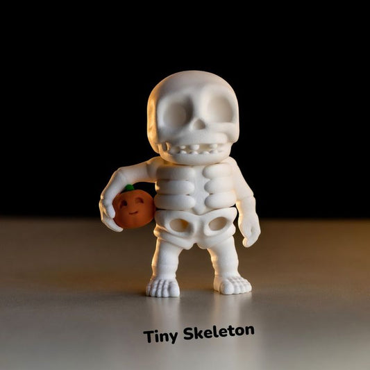 Tiny Skeleton Holding a Pumpkin