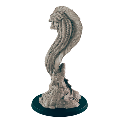 The monstrous, wormlike creature rises sinuously from a rocky mound, its head reared back, exposing its segmented body in a dark, neutral setting.