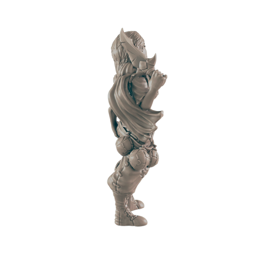 A miniature figurine stands, appearing to hold something, against a plain black background.