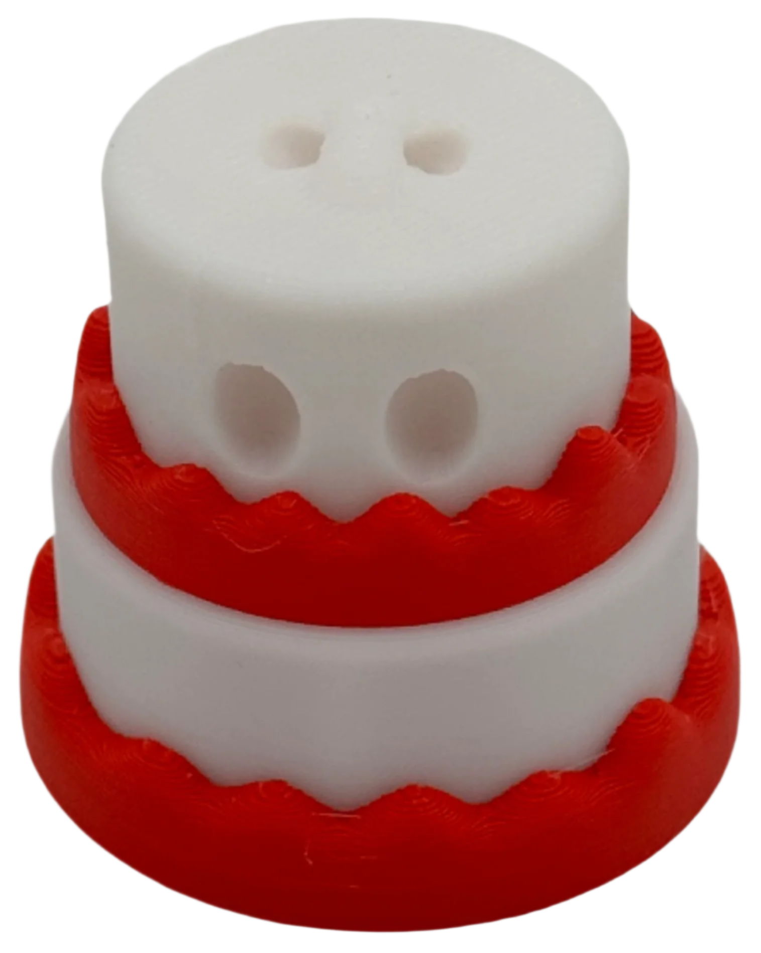 A two-layered cake, white with red frosting, sits on a black background.  The top layer has two small holes.