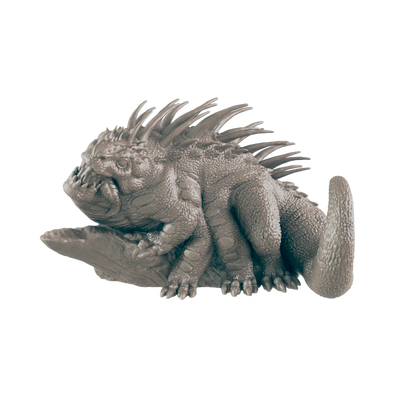 A gray, spiky, and scaly creature with six limbs rests on a small, gray rock. The creature has a short, stubby tail and thick, ridged skin.
