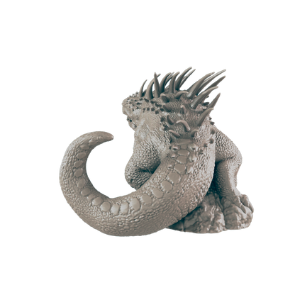 A spiky, reptilian miniature sits on a rocky base against a dark background.