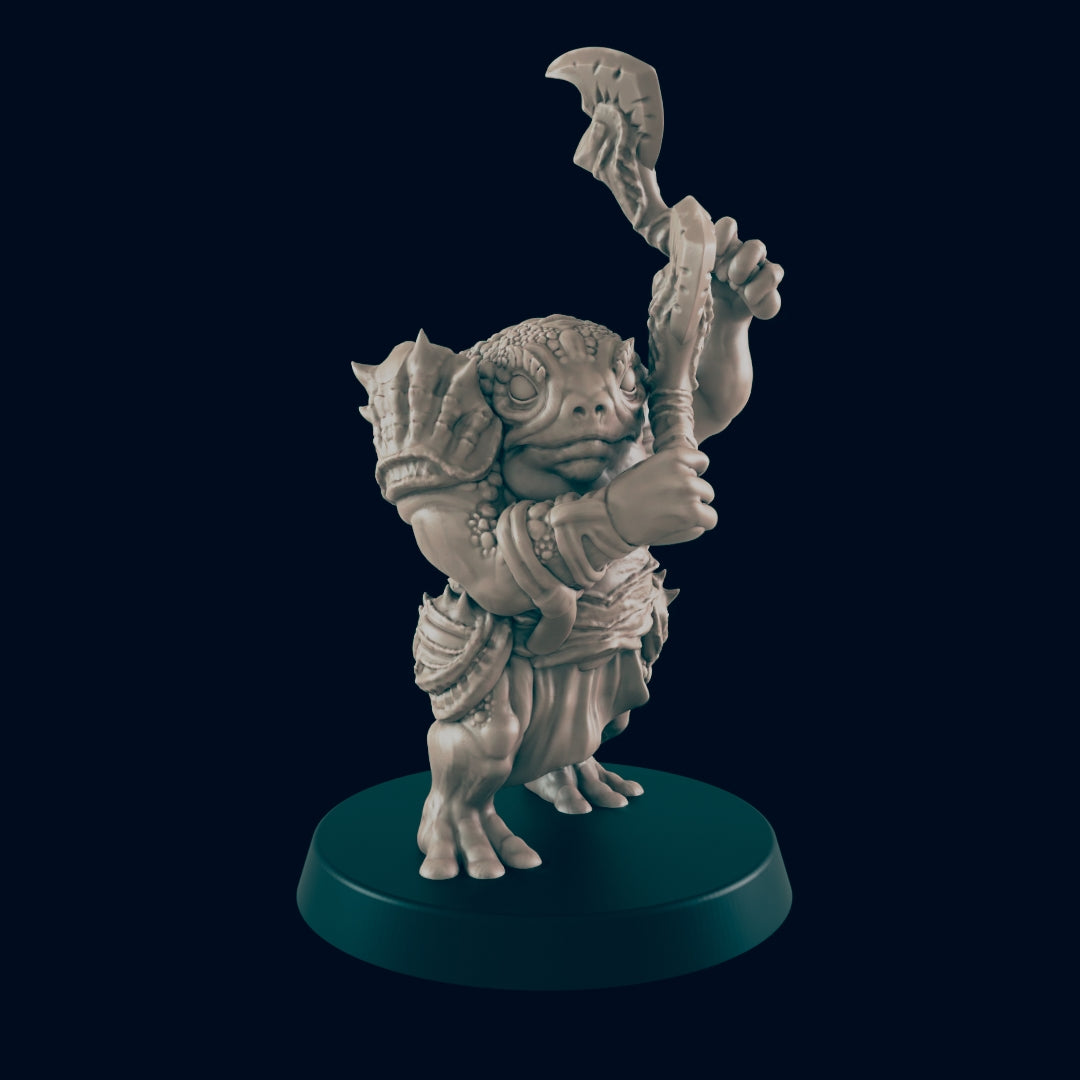 A small, lizard-like humanoid figurine raises a bladed weapon on a circular base. The background is dark.