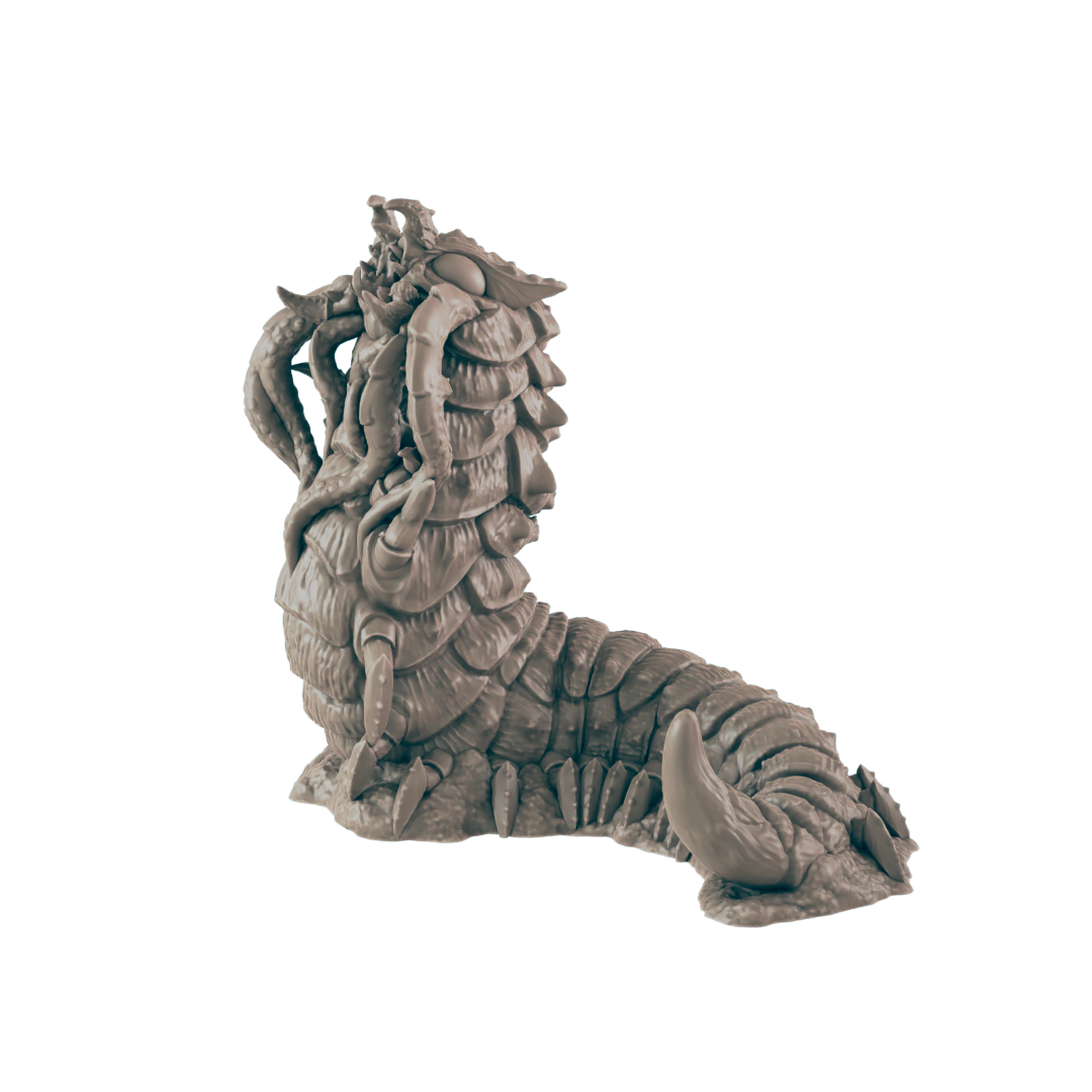 A segmented worm monster with tentacles and claws raises its head. The creature rests on a rocky surface against a dark blue background.