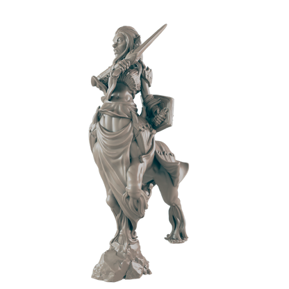 A female centaur miniature wields a sword and shield, standing on a rocky base against a dark background.