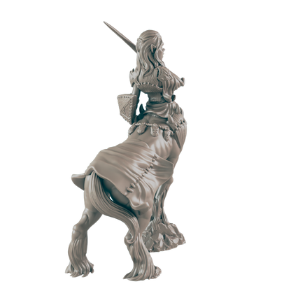 A female centaur miniature, wielding a sword, stands on a rocky base.