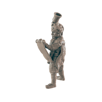 A miniature figurine of a turtle-like creature reads a scroll; it wears a hat and tunic.  The figurine is presented against a black background.