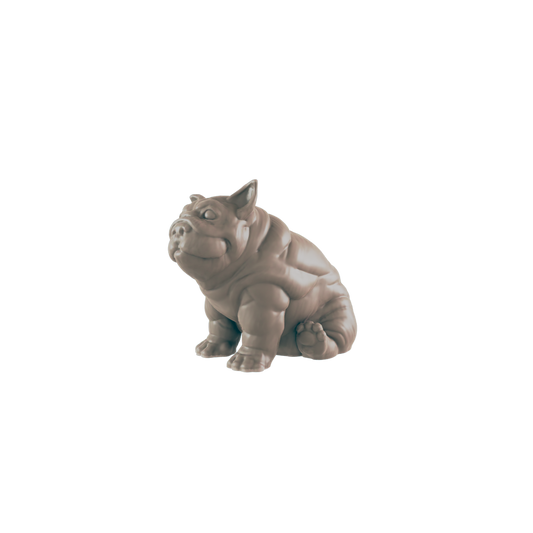 A bulldog figurine sits on a plain background.
