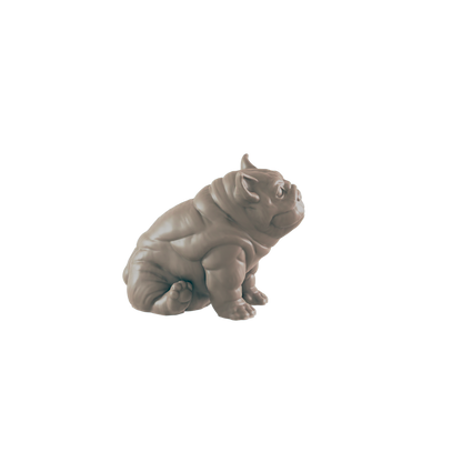 A small, light-brown bulldog figurine sits on a dark background.