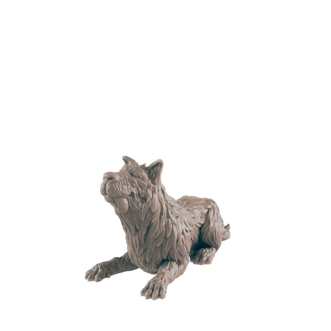 A wolf figurine lies on a dark background, appearing to hold a small object in its mouth.